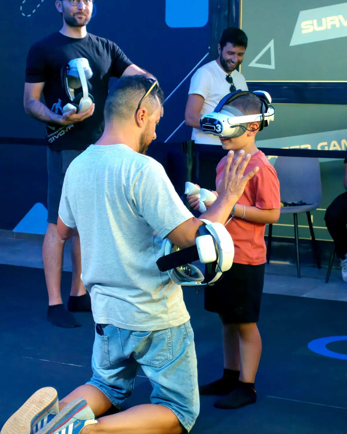 An operator gets a child ready to play with a Vortex Play headset.