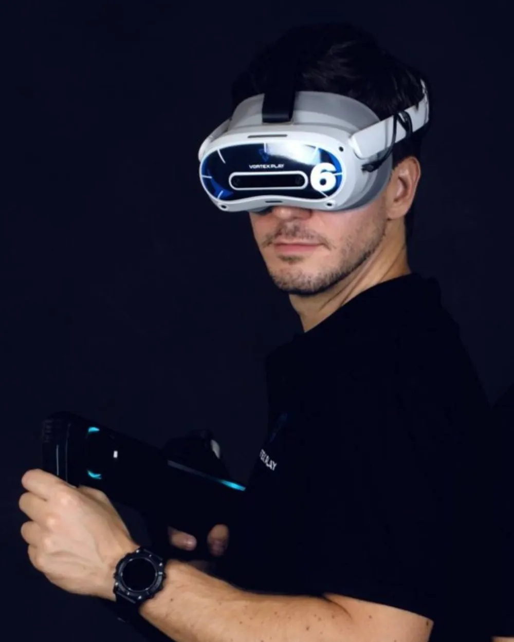 A player wearing a Vortex Play headset holds the Striker gun.